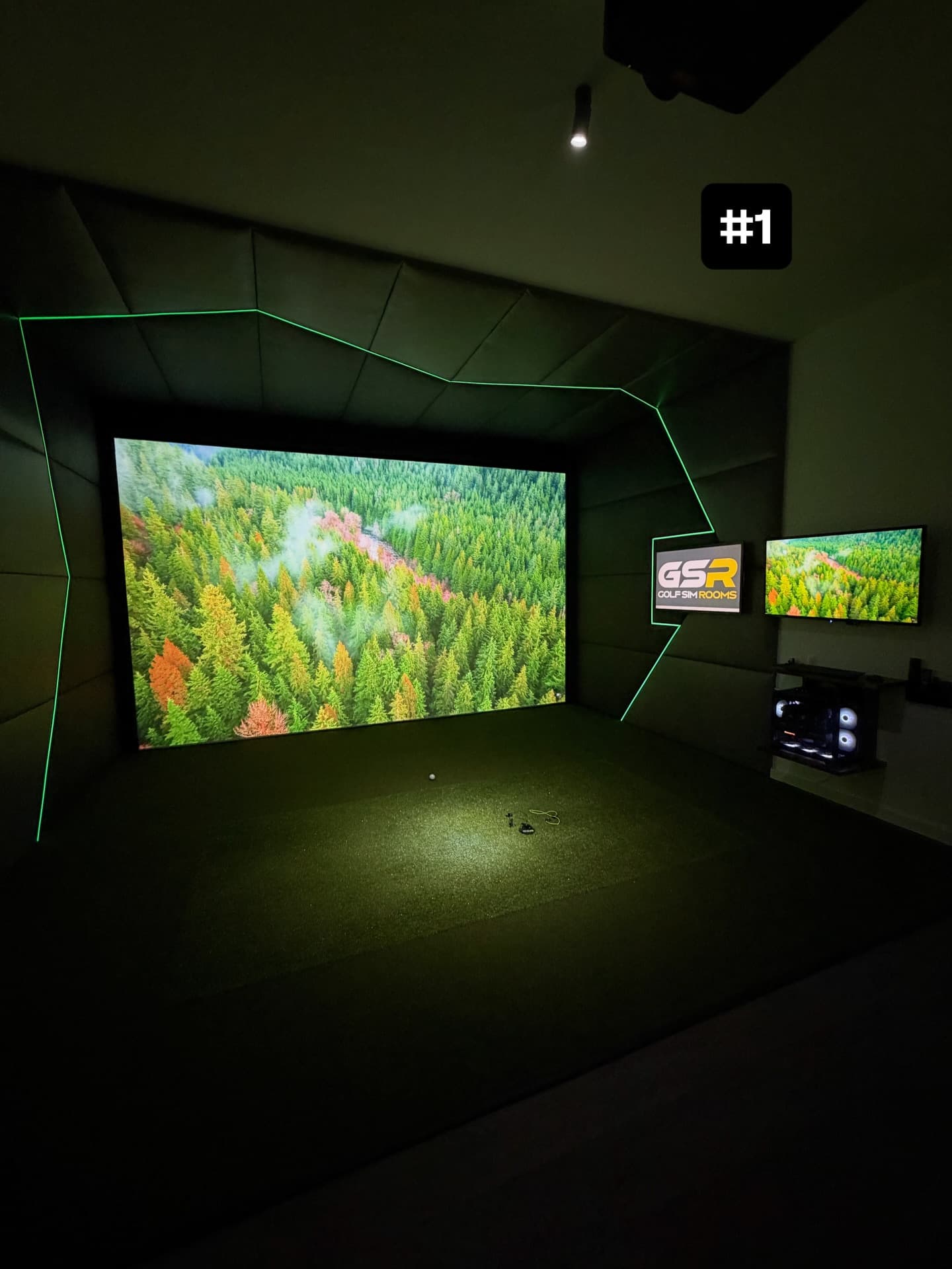 Course view on the simulator screen with green LED edging and two small screens to the right