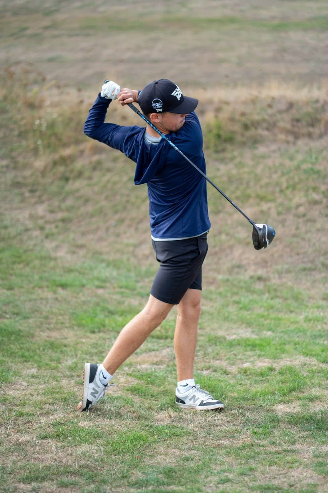 Joshua Mulley swinging a driver on the course