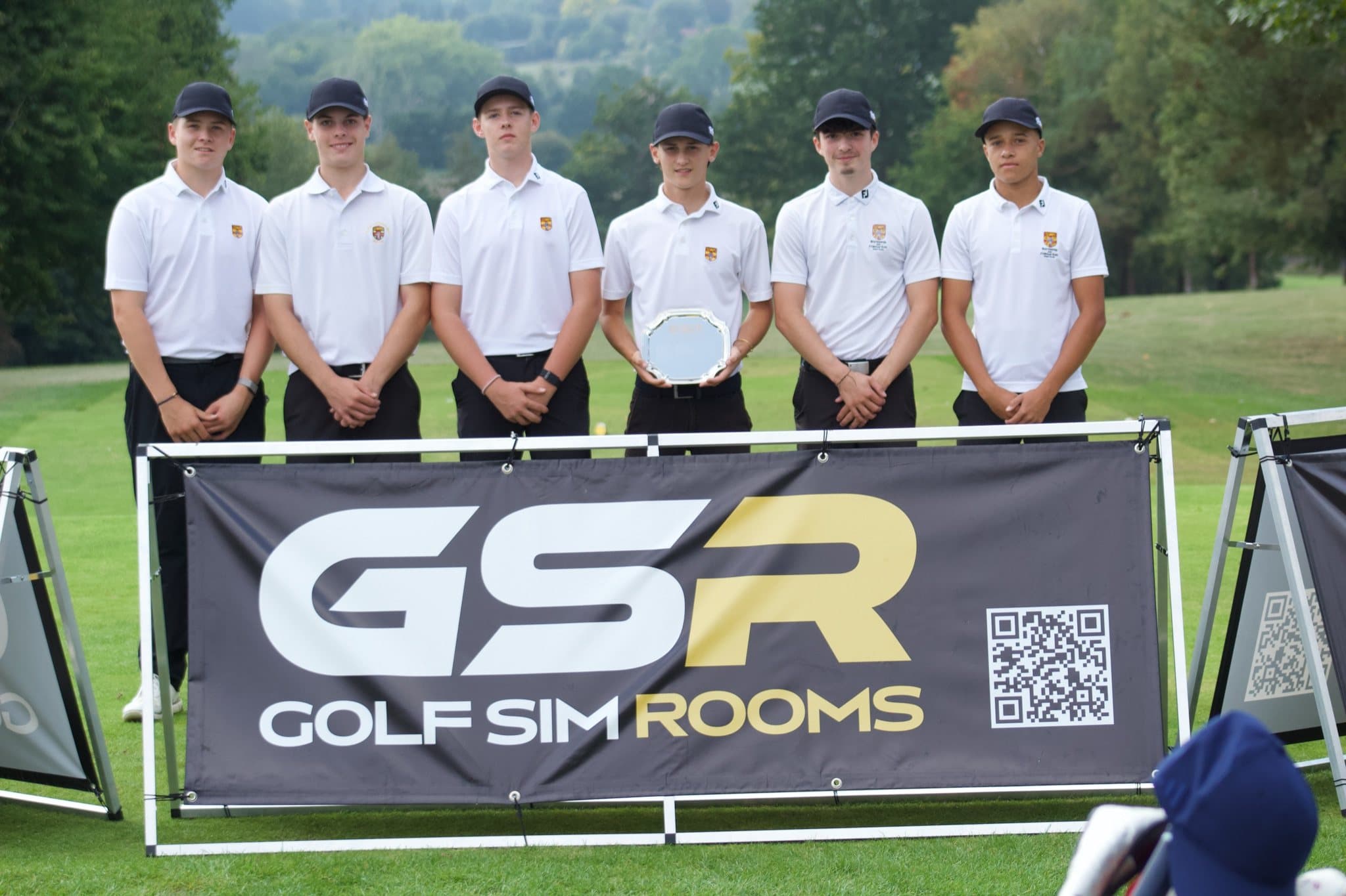 Rochester & Cobham Park, the Plate winners, with the plate behind the Golf Sim Rooms banner