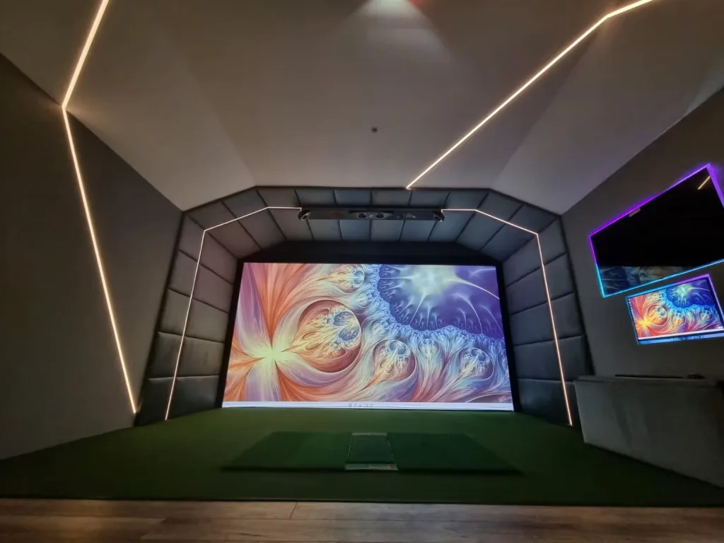 Garage conversion simulator with white LED lines across the ceiling and two wall TVs