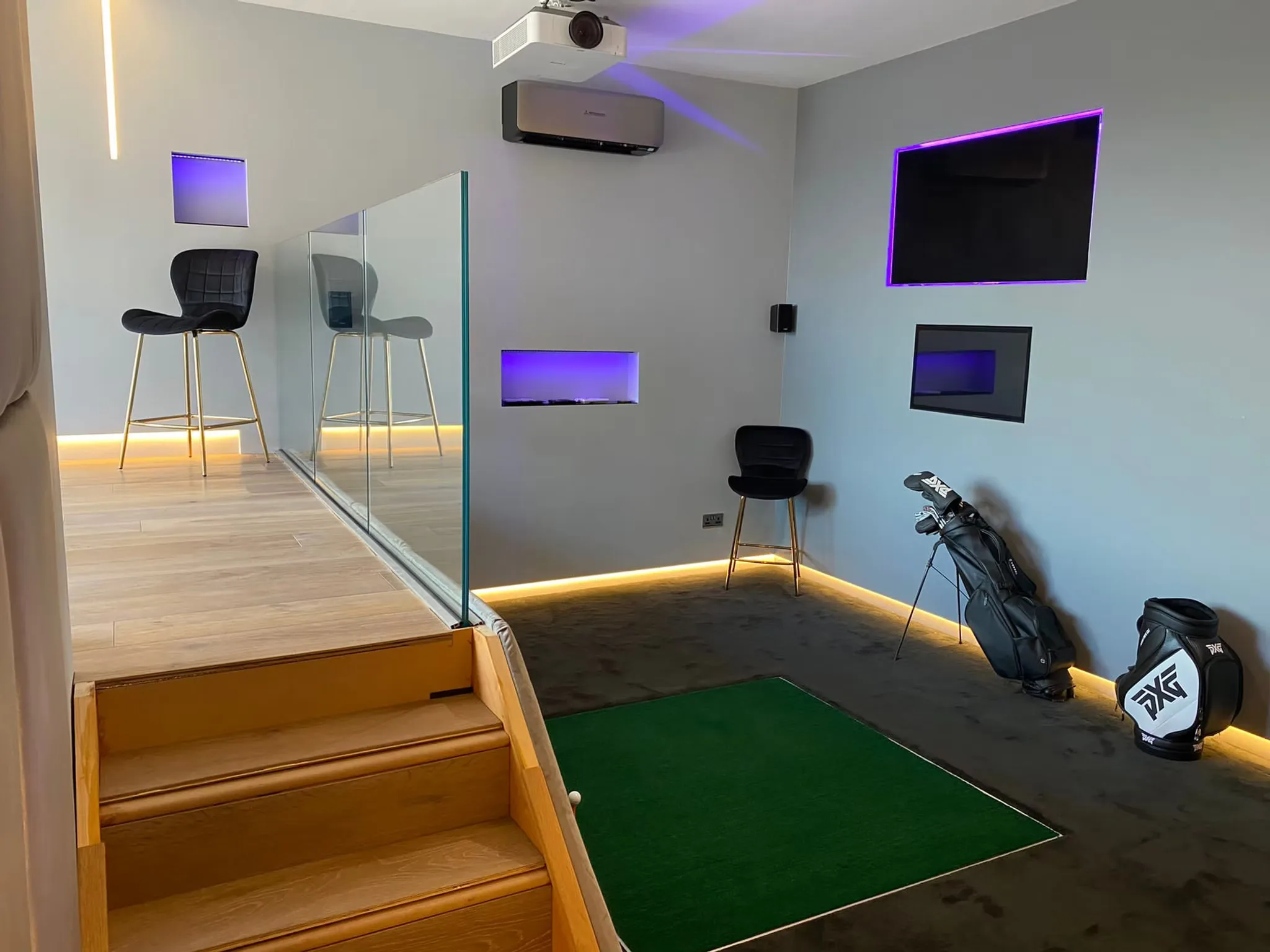inside a gold sim room, with golf accessories