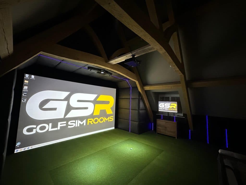 Wide view of the GSR logo on the screen, with blue LED strips on the padded walls and timber trusses above