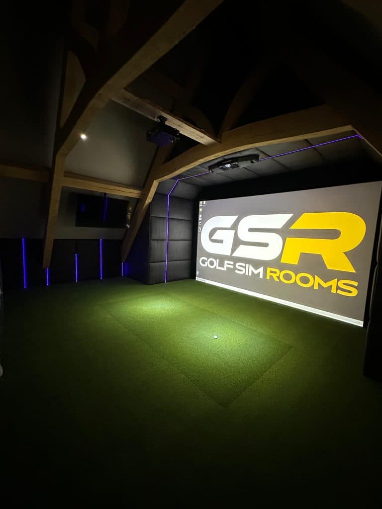 Corner view of the simulator screen with the GSR logo and blue LED strips along the walls
