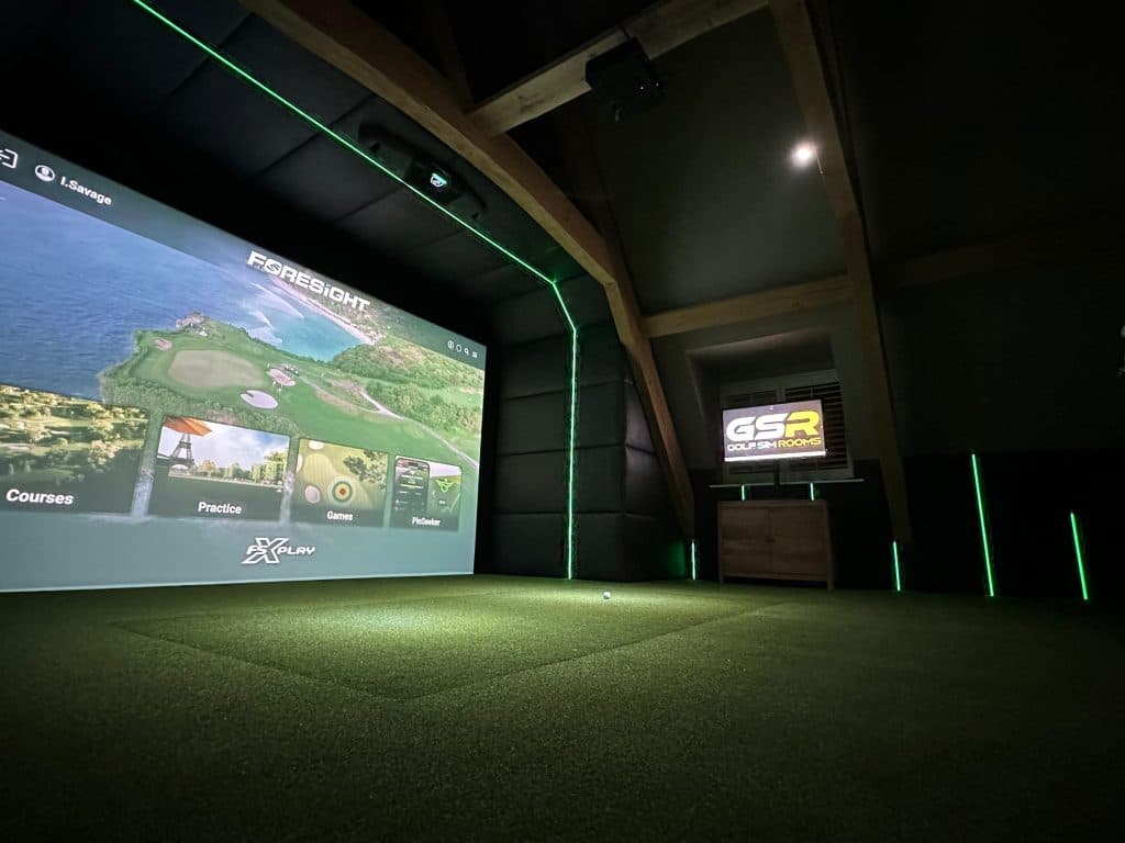Course menu on the simulator screen, with green LED edging and timber roof trusses above the bay
